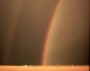 Mananaf (Júnio) 2, 2004, Salmo 145:8-9. Rainbow with reflection over an Oklahoma wheatfield.