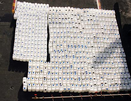 4. Over 600 Containers of Purified Water On the Flight Deck Aboard the USS Abraham Lincoln (CVN 72), January 7, 2005, Indian Ocean. Photo Credit: Photographer's Mate 2nd Class Julian T. Olivari, Navy NewsStand - Eye on the Fleet Photo Gallery (http://www.news.navy.mil/view_photos.asp, 050107-N-6060O-034), United States Navy (USN, http://www.navy.mil), United States Department of Defense (DoD, http://www.DefenseLink.mil or http://www.dod.gov), Government of the United States of America (USA).