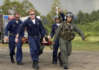 3. Carrying a Tsunami Victim to a Triage Site Located on Sultan Iskandar Muda Air Force Base, January 8, 2005. Banda Aceh, Sumatra, Republik Indonesia. Photo Credit: Photographer's Mate 3rd Class Katrina V. Walter, Navy NewsStand - Eye on the Fleet Photo Gallery (http://www.news.navy.mil/view_photos.asp, 050108-N-6736W-012), United States Navy (USN, http://www.navy.mil), United States Department of Defense (DoD, http://www.DefenseLink.mil or http://www.dod.gov), Government of the United States of America (USA).