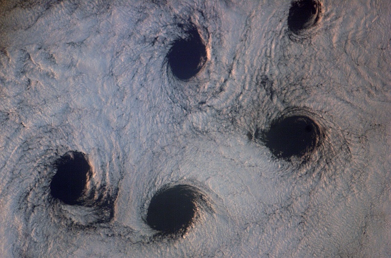 10. 'Holes' in the Clouds: Spectacular Cloud Vortexes -- von Karman Vortices -- From Aleutian I in the Aleutian Islands, State of Alaska on May 23, 2007 at 16:22:00.293 GMT As Seen From the International Space Station (Expedition Fifteen). NASA; ISS015-E-9199, von Karman Vortices, Cloud vortexes from Aleutian I, Aleutian Islands, Alaska, International Space Station (Expedition 15); Image Science and Analysis Laboratory, NASA-Johnson Space Center. 'Astronaut Photography of Earth - Display Record.' <http://eol.jsc.nasa.gov/scripts/sseop/photo.pl?mission=ISS015&roll=E&frame=9199>; National Aeronautics and Space Administration (NASA, http://www.nasa.gov), Government of the United States of America (USA).