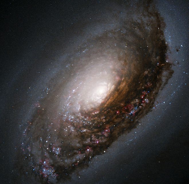 Spiral Galaxy M64 (Messier 64), also known as the 'Black Eye' or 'Evil Eye' Galaxy. Photo Credit: An Abrasive Collision Gives One Galaxy a 'Black Eye', February 5, 2004, STScI-2004-04, NASA's Earth-orbiting Hubble Space Telescope (http://HubbleSite.org); The Hubble Heritage Team (STScI/AURA), National Aeronautics and Space Administration (NASA, http://www.nasa.gov), Government of the United States of America (USA). Acknowledgment: S. Smartt (Institute of Astronomy) and D. Richstone (University of Michigan).