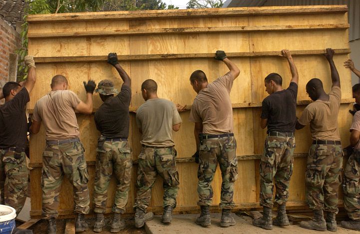Unity In Action -- Together, Engineers Move a Tall, Heavy Concrete Form, April 25, 2005, United States DoD Joint Task Force Exercise New Horizons 2005, Santa Clara Clinic-Building Project, San Vicente, Republica de El Salvador. Photo Credit: Tech. Sgt. John M. Foster of the United States Air Force (USAF), DefenseLINK News Photos - Other Subjects - Military Services - Air Force (http://www.DefenseLink.mil/photos/Other/MilitaryServices/AF, 04/28/05, "Air Force engineers use a lot of muscle to move a concrete form", 050425-F-2869F-091), United States Department of Defense (DoD, http://www.DefenseLink.mil or http://www.dod.gov), Government of the United States of America (USA).