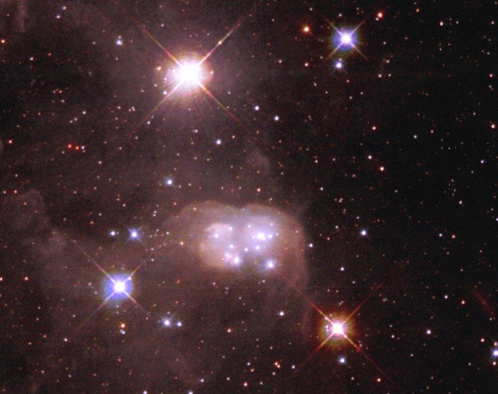 Supergiant Henize S22, the Extraordinarily Massive, Very Bright Star (top, center, slightly towards the left), Illuminates the N30B Nebula, the Peanut-Shaped Cocoon of Dust and 'Double Bubble' Surrounding Hot Stars. Location: Inside the DEM L 106 Nebula Which is Embedded in the Large Magellanic Cloud, a Satellite Galaxy of Earth's Galaxy, the Milky Way. Photo Credit: Hubble Photographs 'Double Bubble' in Neighboring Galaxy, November 14, 1998 and October 18, 2001 (Release date: December 5, 2002), STScI-2002-29, NASA's Earth-orbiting Hubble Space Telescope (http://HubbleSite.org); The Hubble Heritage Team (STScI/AURA), National Aeronautics and Space Administration (NASA, http://www.nasa.gov), Government of the United States of America (USA). Acknowledgment: M.S. Oey (Lowell Observatory) and Y.-H. Chu (University of Illinois).
