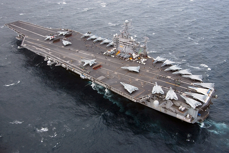 8. Aerial View of United States Navy F-14D Super Tomcat Fighter Jets Staged For Launch Aboard the Aircraft Carrier USS Theodore Roosevelt (CVN 71), March 10, 2006, Atlantic Ocean. Photo Credit: Photographer's Mate 3rd Class Chris Thamann, United States Navy (USN, http://www.navy.mil); Defense Visual Information Center (DVIC, http://www.DoDMedia.osd.mil, DN-SD-07-00511 and 060310-N-6410T-001) and United States Navy (USN, http://www.navy.mil), United States Department of Defense (DoD, http://www.DefenseLink.mil or http://www.dod.gov), Government of the United States of America (USA). For more information, see the United States Navy story 'Squadron Homecoming Marks End of Era for Tomcats' by Journalist 1st Class Stefanie Holzeisen-Mullen, Fleet Public Affairs Center Atlantic, Released: March 10, 2006 at 1:58:00 PM (Story Number: NNS060310-05, http://www.navy.mil/search/display.asp?story_id=22637).