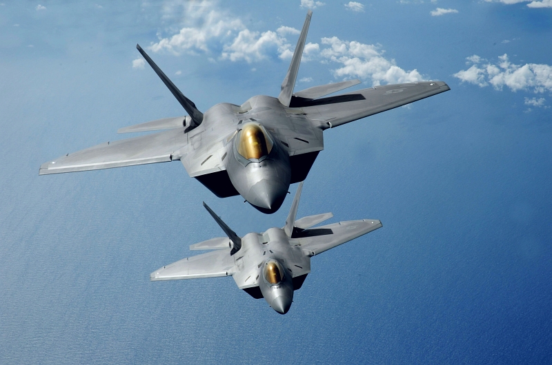 22. Two U.S. Air Force F-22A Raptor Stealth Fighter Jets Fly In Formation Over the Pacific Ocean, March 9, 2009. Photo Credit: Master Sgt. Kevin J. Gruenwald, United States Air Force; Defense Visual Information (DVI, http://www.DefenseImagery.mil, 090309-F-6911G-197 or 090309-F-DP668-197), United States Air Force (USAF, http://www.af.mil), United States Department of Defense (DoD, http://www.DefenseLink.mil or http://www.dod.gov), Government of the United States of America (USA).