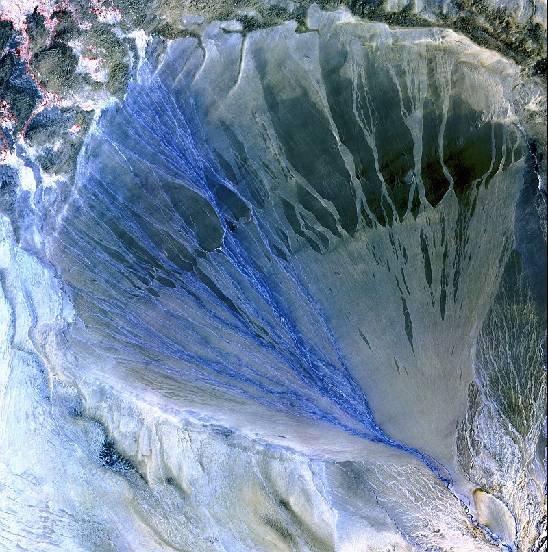14. A Beautiful Alluvial Fan, With the River Branching Into Many Streams of Flowing Blue Water, Between the Kunlun and Altun Mountain Ranges, May 2, 2002, Xinjiang Province, Zhonghua Renmin Gongheguo - People's Republic of China, As Seen By the ASTER Instrument Aboard NASA's Terra Satellite. Photo Credit: The ASTER (Advanced Spaceborne Thermal Emission and Reflection Radiometer) Project (http://asterweb.jpl.nasa.gov) and NASA/GSFC/METI/ERSDAC/JAROS, and U.S./Japan ASTER Science Team; EROS (Earth Resources Observation and Science, http://eros.usgs.gov) Image Gallery Collections (http://eros.usgs.gov/imagegallery) - Earth As Art 2 Image Collection (http://eros.usgs.gov/imagegallery/collection.php?col=Earth+As+Art+2) - Alluvial Fan, United States Geological Survey (USGS, http://www.usgs.gov), United States Department of the Interior (http://www.doi.gov) and National Aeronautics and Space Administration (NASA, http://www.nasa.gov), Government of the United States of America (USA).