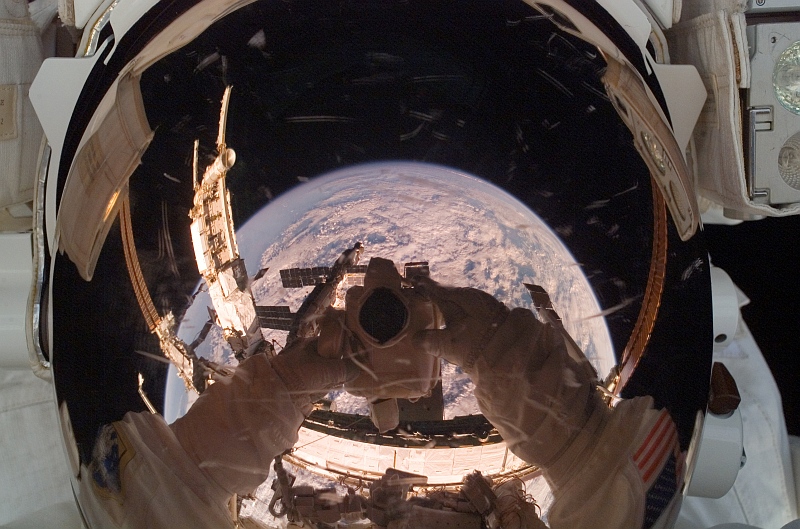 7. A Large Portion of Cloud-Covered Planet Earth Is Reflected In the Helmet Visor of NASA Astronaut Clayton C. Anderson (Clay Anderson), the International Space Station (Expedition 15) Flight Engineer, August 15, 2007. Photo Credit: STS-118 Shuttle Mission Imagery (http://spaceflight.nasa.gov/gallery/images/shuttle/sts-118/ndxpage1.html), ISS015-E-22561 (http://spaceflight.nasa.gov/gallery/images/shuttle/sts-118/html/iss015e22561.html), NASA Human Space Flight (http://spaceflight.nasa.gov), National Aeronautics and Space Administration (NASA, http://www.nasa.gov), Government of the United States of America.