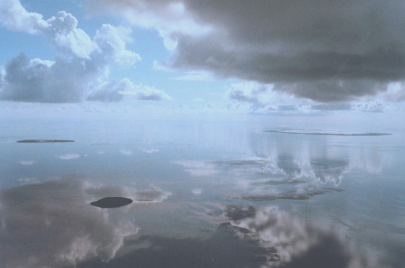 Sky, Clouds, and Their Reflections On The Morning, Still, Mirror-Like Waters, Key West, State of Florida, USA. Photo Credit: Lieutenant Debora Barr, NOAA Corps; National Oceanic and Atmospheric Administration Photo Library (http://www.photolib.noaa.gov, wea02195), Historic NWS Collection, NOAA Central Library, National Oceanic and Atmospheric Administration (NOAA, http://www.noaa.gov), United States Department of Commerce (http://www.commerce.gov), Government of the United States of America (USA).