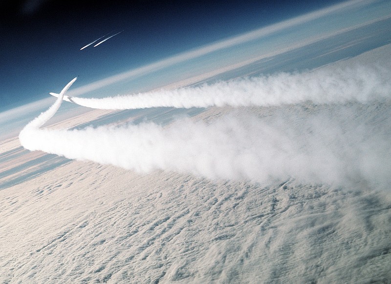 1. State of Alaska, USA, August 1989 -- Vigilant and Protective: High above beautiful Earth, United States Air Force (USAF) F-15 Eagle fighter jets intercept two CCCP (Soyuz Sovetskikh Sotsialisticheskikh Respublik, or in English, Union of Soviet Socialist Republics -- USSR) Mikoyan-Gurevich MiG-29 (also referred to as 'Mikoyan MiG-29') aircraft. The Soviet MiG-29s are, for the first time, traveling to the Abbotsford International Airshow in Abbotsford, British Columbia, Canada, to participate in the August 1989 airshow. The USAF F-15 Eagle interceptors actively guarding North American and United States of America's airspace are with the 21st Tactical Fighter Wing, based at Elmendorf Air Force Base (AFB), Alaska, and assigned (going up through the chain of command) to Alaskan Air Command (AAC), Alaskan Command (ALCOM), United States Pacific Air Forces (USPACAF or PACAF), United States Pacific Command (USPACOM or PACOM). Both MiG-29 'Fulcrum' fighters and the Antonov An-225 Mriya ('Cossak'), the large heavy support transport aircraft, refueled at Elmendorf AFB and continued on their journey to Abbotsford, British Columbia, Canada. Photo Credit: SSgt. Kevin L. Bishop, United States Air Force (USAF, http://www.af.mil); Defense Visual Information Center (DVIC, http://www.DoDMedia.osd.mil, DFST9005759) and United States Air Force (USAF, http://www.af.mil), United States Department of Defense (DoD, http://www.DefenseLink.mil or http://www.dod.gov), Government of the United States of America (USA).