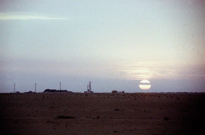 3. Sunrise, November 5, 1994, Liberty Tactical Assembly Area, Dawlat al Kuwayt - State of Kuwait. Photo Credit: Spc. Moses M. Mlasko, United States Army (U.S. Army, http://www.army.mil); Defense Visual Information Center (DVIC, http://www.DoDMedia.osd.mil, DAST9804396 and D204SPT9533013597) and United States Army (U.S. Army, http://www.army.mil), United States Department of Defense (DoD, http://www.DefenseLink.mil or http://www.dod.gov), Government of the United States of America (USA).