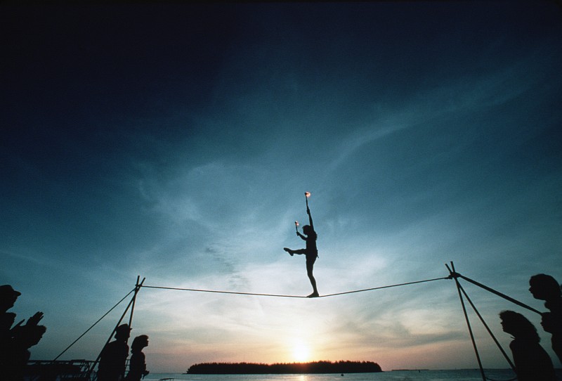 55. Tightrope Walker at Sunset, September 1, 1985, Key West, State of Florida, USA. Photo Credit: PH1 Perry Thorsvik, United States Navy (USN, http://www.navy.mil); Defense Visual Information Center (DVIC, http://www.DoDMedia.osd.mil, DNST8702304) and United States Navy (USN, http://www.navy.mil), United States Department of Defense (DoD, http://www.DefenseLink.mil or http://www.dod.gov), Government of the United States of America (USA).