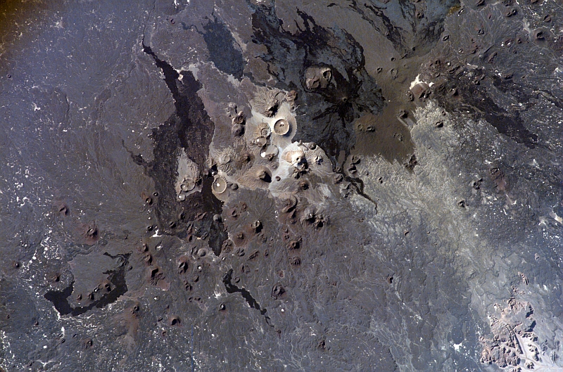 91. Khaybar Volcanics and Khaybar Lava Field at Harrat Khaybar, February 16, 2007 at 13:34:02.194 GMT, Al Mamlakah al Arabiyah as Suudiyah - Kingdom of Saudi Arabia, As Seen From the International Space Station (Expedition 14). Photo Credit: NASA; ISS014-E-20368, Volcanics, Lava field, Harrat Khaybar (includes Jabal al Qidr, Jabal Abyad, and Jabal Bayda'), Saudi Arabia, International Space Station (Expedition Fourteen); Image Science and Analysis Laboratory, NASA-Johnson Space Center. 'Astronaut Photography of Earth - Display Record.' <http://eol.jsc.nasa.gov/scripts/sseop/photo.pl?mission=ISS014&roll=E&frame=20368>; National Aeronautics and Space Administration (NASA, http://www.nasa.gov), Government of the United States of America (USA).