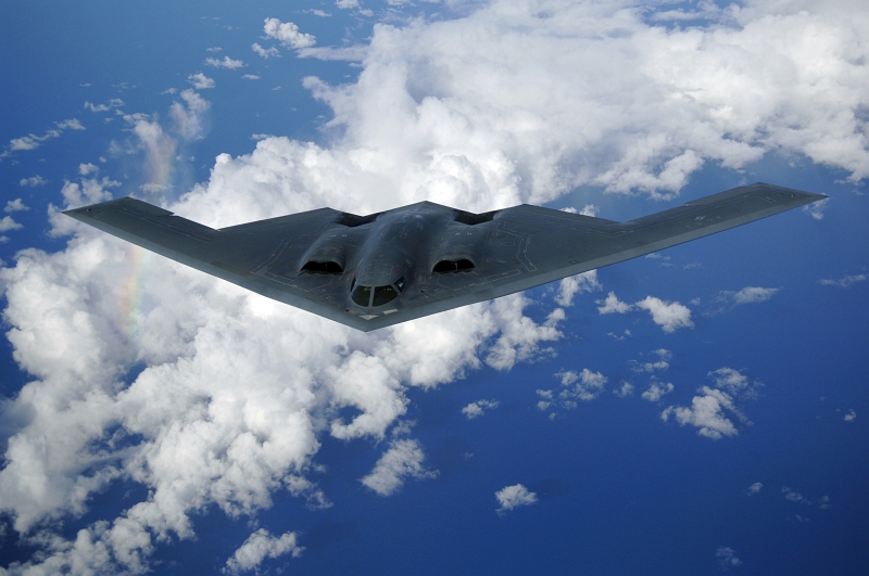 53. Backdropped By Rainbow Colors In the Clouds, the U.S. Air Force B-2 Spirit Stealth Bomber Soars High Above the Pacific Ocean, May 30, 2006. Photo Credit: Staff Sgt. Bennie J. Davis III, United States Air Force; Air Force Link - Photos (http://www.af.mil/photos, 060530-F-5040D-178, 'Over the Pacific'), United States Air Force (USAF, http://www.af.mil), United States Department of Defense (DoD, http://www.DefenseLink.mil or http://www.dod.gov), Government of the United States of America (USA).