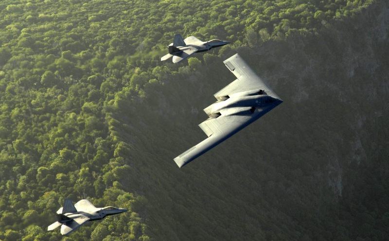 4. The B-2 Spirit and Two F-22A Raptor Fighters Fly In Formation Above the Cliffs, April 14, 2009, Territory of Guam, USA. Photo Credit: Master Sgt. Kevin J. Gruenwald, United States Air Force (USAF, http://www.af.mil); Defense Visual Information (DVI, http://www.DefenseImagery.mil, 090414-F-6911G-004) and United States Air Force (USAF, http://www.af.mil), United States Department of Defense (DoD, http://www.DefenseLink.mil or http://www.dod.gov), Government of the United States of America (USA).
