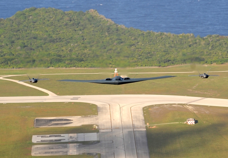 1. Two U.S. Air Force F-22A Raptor Stealth Fighter Jets and One U.S. Air Force B-2 Spirit Stealth Bomber Fly In Formation Over Andersen Air Force Base, April 7, 2009, Territory of Guam, USA. Photo Credit: Master Sgt. Kevin J. Gruenwald, United States Air Force; Defense Visual Information (DVI, http://www.DefenseImagery.mil, 090414-F-6911G-008) and United States Air Force (USAF, http://www.af.mil), United States Department of Defense (DoD, http://www.DefenseLink.mil or http://www.dod.gov), Government of the United States of America (USA).