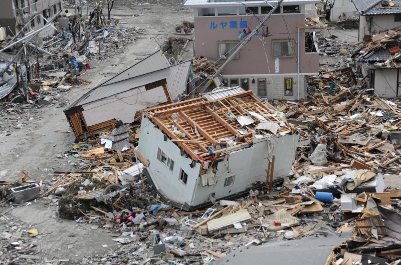 1. An Upended House In the Debris and Rubble In Ofunato, March 15, 2011, Nippon-koku (Nihon-koku) - Japan. Photo Credit: Mass Communication Specialist 1st Class Matthew M. Bradley, United States Navy; Defense Visual Information (DVI, http://www.DefenseImagery.mil, 110315-N-KK192-107) and United States Navy (USN, http://www.navy.mil, 110315-N-2653B-107, http://www.navy.mil/view_image.asp?id=98447, http://www.navy.mil/management/photodb/photos/110315-N-2653B-107.jpg), United States Department of Defense (DoD, http://www.DefenseLink.mil or http://www.dod.gov), Government of the United States of America (USA).
