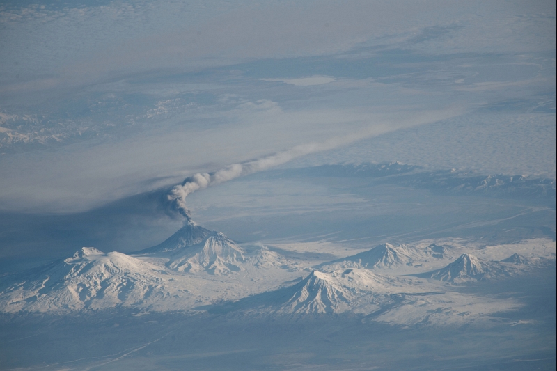 Eruption Plume of the Kliuchevskoi Volcano, November 16, 2013 at 23:31:48 GMT, As Seen From the International Space Station (Expedition 38), Latitude (LAT): 47.4, Longitude (LON): 143.5, Altitude (ALT): 221 Nautical Miles, Sun Azimuth (AZI): 141 degrees, Sun Elevation Angle (ELEV): 15 degrees. Photo Credit: NASA; ISS038-E-5513, Russia, Kamchatka Peninsula, Ushkovsky Volcano, Kliuchevskoi Volcano with plume (ISS038-E-5515), Bezymianny Volcano, Tolbachik Volcano, Zimina Volcano, Udina Volcano, International Space Station (Expedition 38); Image Science and Analysis Laboratory, NASA-Johnson Space Center. "The Gateway to Astronaut Photography of Earth." <http://eol.jsc.nasa.gov/SearchPhotos/photo.pl?mission=ISS038&roll=E&frame=5513>; National Aeronautics and Space Administration (NASA, http://www.nasa.gov), Government of the United States of America (USA).