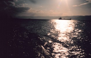 2. A Sunset at, and a Ship Traveling Through, the Red Sea. Photo Credit: Mr. Ben Mieremet, Senior Advisor OSD, NOAA; National Oceanic and Atmospheric Administration Photo Library (http://www.photolib.noaa.gov), Small World Collection, National Oceanic and Atmospheric Administration (NOAA, http://www.noaa.gov), United States Department of Commerce (http://www.commerce.gov), Government of the United States of America.