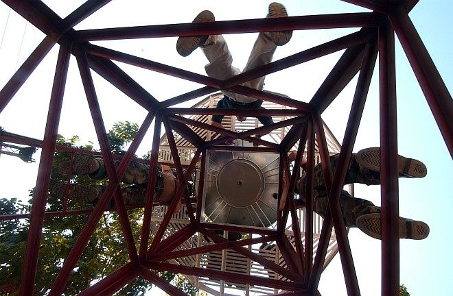 Working Together on Water Tank (and Deep Well) Repairs at the Bacungan Elementary School, February 25, 2004 Puerto Princesa, Palawan, Republika ng Pilipinas - Republic of the Philippines. Photo Credit: Photographer's Mate 2nd Class Felix Garza Jr., Navy NewsStand - Eye on the Fleet Photo Gallery (http://www.news.navy.mil/view_photos.asp, 040225-N-4142G-030), United States Navy (USN, http://www.navy.mil), United States Department of Defense (DoD, http://www.DefenseLink.mil or http://www.dod.gov), Government of the United States of America (USA).