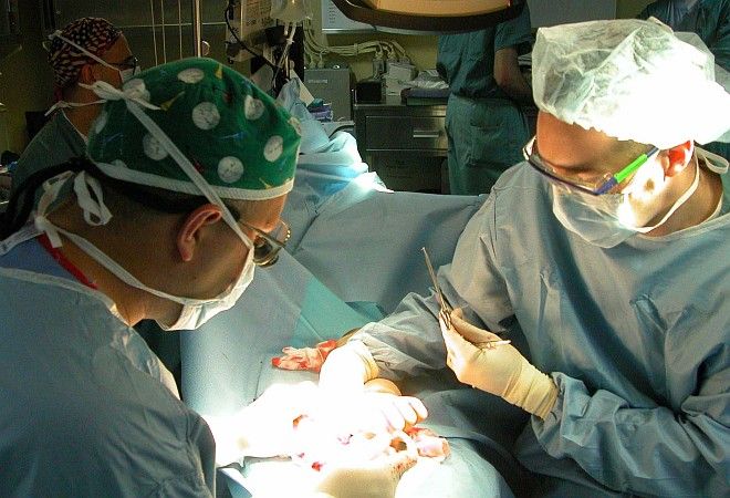 Hand Surgery Aboard the USS Kearsarge (LHD 3) on April 25, 2003 in the Arabian Gulf. Photo Credit: Photographer's Mate Airman Apprentice Finley Williams, Navy NewsStand - Eye on the Fleet Photo Gallery (http://www.news.navy.mil/view_photos.asp, 030425-N-2382W-001), United States Navy (USN, http://www.navy.mil), United States Department of Defense (DoD, http://www.DefenseLink.mil or http://www.dod.gov), Government of the United States of America (USA).