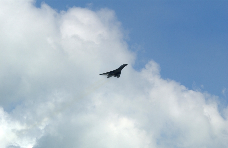 1. A B-1B Lancer Bomber Creating a Prandtl-Glauert Condensation Cloud, United States Air Force. January 16, 2004, Southwest Asia. USAF image ID number: 040116-F-0971G-140. Flying at transonic speeds -- speeds varying near and at the speed of sound (supersonic) -- can generate impressive condensation clouds caused by the Prandtl-Glauert Singularity. For a scientific explanation, see Dr. Mark. S. Cramer's Gallery of Fluid Mechanics, Prandtl-Glauert Singularity at <http://www.GalleryOfFluidMechanics.com/conden/pg_sing.htm>; the Prandtl-Glauert Condensation Clouds tutorial at <http://FluidMech.net/tutorials/sonic/prandtl-glauert-clouds.htm>; and Foundations of Fluid Mechanics, Navier-Stokes Equations Potential Flows: Prandtl-Glauert Similarity Laws at <http://www.Navier-Stokes.net/nspfsim.htm>. Photo Credit: Staff Sgt. Shelley Gill, Still Photography Journeyman, 125th Fighter Wing, Florida Air National Guard, USA; 040116-F-0971G-140, United States Air Force (USAF, http://www.af.mil), United States Department of Defense (DoD, http://www.DefenseLink.mil or http://www.dod.gov), Government of the United States of America (USA).