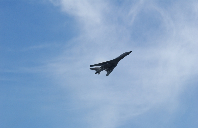 5. A B-1B Lancer Bomber Creating a Prandtl-Glauert Condensation Cloud, United States Air Force. January 16, 2004, Southwest Asia. USAF image ID number: 040116-F-0971G-145. Flying at transonic speeds -- speeds varying near and at the speed of sound (supersonic) -- can generate impressive condensation clouds caused by the Prandtl-Glauert Singularity. For a scientific explanation, see Dr. Mark. S. Cramer's Gallery of Fluid Mechanics, Prandtl-Glauert Singularity at <http://www.GalleryOfFluidMechanics.com/conden/pg_sing.htm>; the Prandtl-Glauert Condensation Clouds tutorial at <http://FluidMech.net/tutorials/sonic/prandtl-glauert-clouds.htm>; and Foundations of Fluid Mechanics, Navier-Stokes Equations Potential Flows: Prandtl-Glauert Similarity Laws at <http://www.Navier-Stokes.net/nspfsim.htm>. Photo Credit: Staff Sgt. Shelley Gill, Still Photography Journeyman, 125th Fighter Wing, Florida Air National Guard, USA; 040116-F-0971G-145, United States Air Force (USAF, http://www.af.mil), United States Department of Defense (DoD, http://www.DefenseLink.mil or http://www.dod.gov), Government of the United States of America (USA).