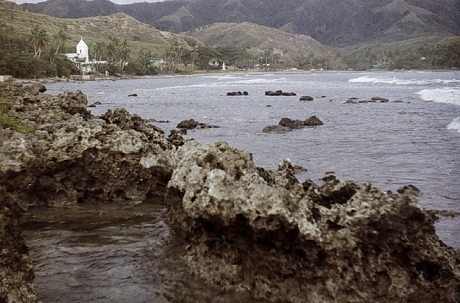 Southern Guam's Hills and Dormant Volcanic Mountains Surround the Village and Umatac Bay, 1966. Umatac, Territory of Guam, USA. Photo Credit: Captain Albert E. Theberge, NOAA Corps (ret.), National Oceanic and Atmospheric Administration Photo Library (http://www.photolib.noaa.gov, theb3087), Historic C&GS Collection, NOAA Central Library, National Oceanic and Atmospheric Administration (NOAA, http://www.noaa.gov), United States Department of Commerce (http://www.commerce.gov), Government of the United States of America (USA).