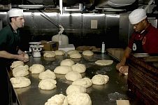 9. Preparing Bread on the USS Abraham Lincoln (CVN 72) For the Suffering Men, Women, and Children in Aceh, Sumatra, Republik Indonesia. January 2, 2005, Indian Ocean. Photo Credit: Photographer's Mate Airman Apprentice Timothy C. Roache Jr., Navy NewsStand - Eye on the Fleet Photo Gallery (http://www.news.navy.mil/view_photos.asp, 050102-N-5837R-011), United States Navy (USN, http://www.navy.mil), United States Department of Defense (DoD, http://www.DefenseLink.mil or http://www.dod.gov), Government of the United States of America (USA).