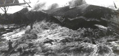 12. The Huge Tsunami - a Massive Wall of Water - Breaks Over Pier No. 1 in Hilo Harbor. The man standing in the foreground, lower left corner, did not survive. After this natural disaster the Pacific Tsunami Warning Center (PTWC) <http://www.prh.noaa.gov/pr/ptwc> was established.  The PTWC is located in Ewa Beach, Hawaii, USA. April 1, 1946, Hilo, State of Hawaii, USA. Photo Credit: National Oceanic and Atmospheric Administration Photo Library (http://www.photolib.noaa.gov, theb2705), Historic C&GS Collection, NOAA Central Library, National Oceanic and Atmospheric Administration (NOAA, http://www.noaa.gov), United States Department of Commerce (http://www.commerce.gov), Government of the United States of America (USA). Additional information from NOAA News Online (Story 2200), April 1, 2004: NOAA Leading the Way in Tsunami Research and Education <http://www.noaanews.noaa.gov/stories2004/s2200.htm>: "The photo was taken from the Brigham Victory, which was in the harbor at the time of the event. The ship was caught by the waves and tossed about but was able to use its own power to avoid the reefs and get past the breakwater to the open sea."