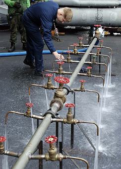 1. Testing the Purified Water Coming From a Potable Water Manifold, January 4, 2005, USS Abraham Lincoln (CVN 72), Indian Ocean. Photo Credit: Photographer's Mate Airman Jordon R. Beesley, Navy NewsStand - Eye on the Fleet Photo Gallery (http://www.news.navy.mil/view_photos.asp, 050104-N-4166B-047), United States Navy (USN, http://www.navy.mil), United States Department of Defense (DoD, http://www.DefenseLink.mil or http://www.dod.gov), Government of the United States of America (USA).