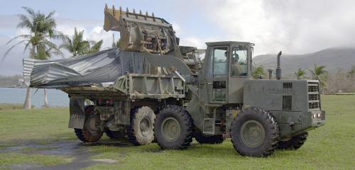 3. Loading Debris From Supertyphoon Pongsona Into a Dump Truck on Guam. On December 8, 2002 this powerful Pacific Ocean typhoon passed directly over and caused significant damage to Guam and the Commonwealth of the Northern Mariana Islands (CNMI), USA. Earlier that year, July 5, 2002, both places suffered a direct hit from Typhoon Chata'an. December 16, 2002, Santa Rita, Territory of Guam, USA. Photo Credit: Photographer's 2nd Class (AW) Nathanael T. Miller, Navy NewsStand - Eye on the Fleet Photo Gallery (http://www.news.navy.mil/view_photos.asp, 021216-N-7293M-014, Super Typhoon Pongsona), United States Navy (USN, http://www.navy.mil), United States Department of Defense (DoD, http://www.DefenseLink.mil or http://www.dod.gov), Government of the United States of America (USA).