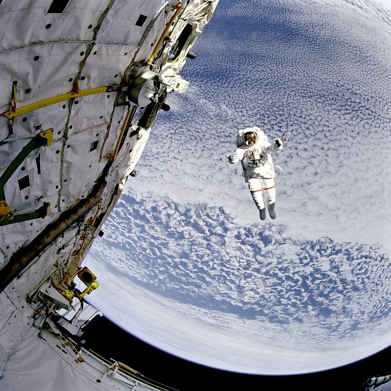 20. NASA Astronaut Mark C. Lee Tests NASA's New Simplified Aid for EVA Rescue (SAFER) System While Floating Untethered High Above Beautiful Blue-and-White Earth, September 16, 1994 at 15:19:42 GMT, South Pacific Ocean As Seen From Space Shuttle Discovery (STS-64), Latitude (LAT): -55.0, Longitude (LON): -99.4, Altitude (ALT): 129 Nautical Miles, Sun Azimuth (AZI): 53 degrees, Sun Elevation Angle (ELEV): 20 degrees. Photo Credit: NASA; Earth, Clouds, Space Shuttle Discovery (STS-64), NASA Astronaut Mark C. Lee, EVA (Extravehicular Activity), GRIN (http://grin.hq.nasa.gov) Database Number: GPN-2000-001040 (STS064-217-008 or STS064-217-8, http://eol.jsc.nasa.gov/scripts/sseop/photo.pl?mission=STS064&roll=217&frame=8), National Aeronautics and Space Administration (NASA, http://www.nasa.gov), Government of the United States of America.