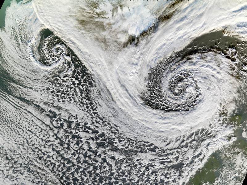 12. Two Spectacular, Swirling Storms -- Dual Cyclones -- In the North Atlantic Ocean Separated By Lydveldid Island - Republic of Iceland, November 20, 2006, As Seen By the MODIS Instrument Aboard NASA's Terra Satellite. Photo Credit: NASA; MODIS (Moderate Resolution Imaging Spectroradiometer) instrument aboard NASA's Terra satellite, Jesse Allen of NASA's Earth Observatory Team, and NASA's Earth Observatory; National Aeronautics and Space Administration (NASA, http://www.nasa.gov), Government of the United States of America (USA).