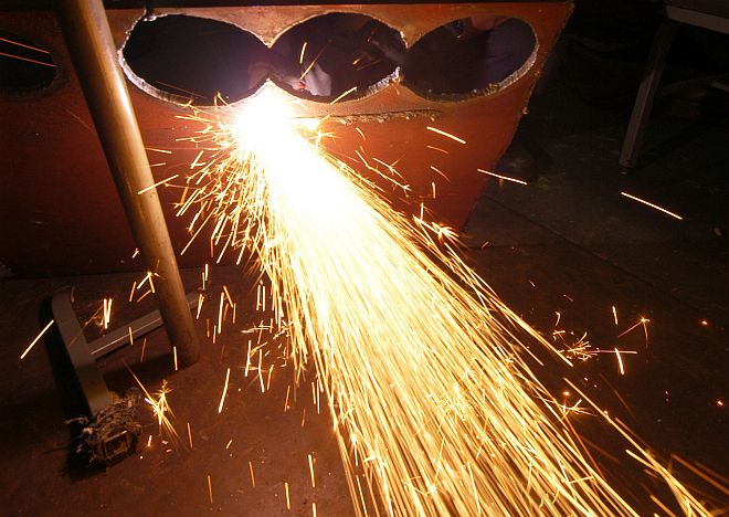 Cutting Out a Steel Plate Makes a Bright Stream of Sparks, January 28, 2005. USS John F. Kennedy (CV 67), Atlantic Ocean. Photo Credit: Photographer's Mate 3rd Class Joshua Karsten, Navy NewsStand - Eye on the Fleet Photo Gallery (http://www.news.navy.mil/view_photos.asp, 050128-N-8704K-002), United States Navy (USN, http://www.navy.mil); United States Department of Defense (DoD, http://www.DefenseLink.mil or http://www.dod.gov), Government of the United States of America (USA).