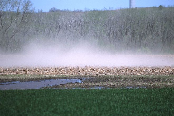 The Wind Blows and Lifts Dust and Dirt - Wind Erosion - Off the Unprotected Cultivated Field in Manhattan, State of Kansas, USA. Photo Credit: Jeff Vanuga (2002, http://photogallery.nrcs.usda.gov, NRCSKS02050), USDA Natural Resources Conservation Service (NRCS, http://www.nrcs.usda.gov), United States Department of Agriculture (USDA, http://www.usda.gov), Government of the United States of America (USA).