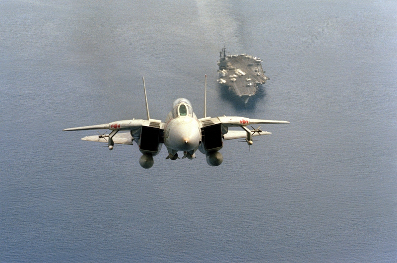 4. Front Air-to-Air View of a United States Navy F-14A Tomcat fighter jet -- Armed With Two AIM-54 Phoenix Missiles, Two AIM-7 Sparrow Missles, and Two AIM-9 Sidewinder Missiles -- Just After Takeoff From the Aircraft Carrier USS America (CV-66), January 1, 1984, Indian Ocean. Photo Credit: CW02 Leo, United States Navy (USN, http://www.navy.mil); Defense Visual Information Center (DVIC, http://www.DoDMedia.osd.mil and http://www.DefenseImagery.mil, DNSC8411122) and United States Navy (USN, http://www.navy.mil), United States Department of Defense (DoD, http://www.DefenseLink.mil or http://www.dod.gov), Government of the United States of America (USA).