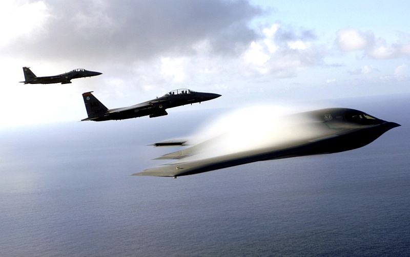 1. Blue Sky, White Clouds -- It's a Great Day For Flying Over the Huge, Beautiful, Blue Pacific Ocean: Two USAF F-15E Strike Eagle Fighter Jets and a USAF B-2 Spirit Stealth Bomber With Its White Condensation Cloud (Vapor Cloud), July 2005. Andersen Air Force Base, Territory of Guam, USA. Photo Credit: USAF Technical Sgt. (TSgt.) Cecilio M. Ricardo, Air Force Link - Week in Photos, July 8, 2005 (http://www.af.mil/weekinphotos/050708-01.html, 'Formation'), United States Air Force (USAF, http://www.af.mil), United States Department of Defense (DoD, http://www.DefenseLink.mil or http://www.dod.gov), Government of the United States of America (USA). See also http://ChamorroBible.org/gpw/gpw-20051129.htm and ChamorroBible.org: The Spectacular Clouds of the Transonic Flight Regime <http://ChamorroBible.org/gpw/gpw-The-Spectacular-Clouds-of-the-Transonic-Flight-Regime.htm>.