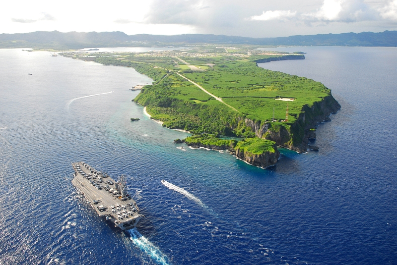 9. Aerial View of the U.S. Navy Nimitz-Class Aircraft Carrier USS Ronald Reagan (CVN 76) Pulling Into Agana Harbor, July 6, 2008, Territory of Guam, USA. Also visble are Apra Harbor, Point Udall (Orote Point), the long Orote Peninsula, and Agat Bay. Photo Credit: Mass Communication Specialist 2nd Class Jennifer S. Kimball, United States Navy; Defense Visual Information (DVI, http://www.DefenseImagery.mil, Still Image: 080706-N-0640K-001) and United States Navy (USN, http://www.navy.mil), United States Department of Defense (DoD, http://www.DefenseLink.mil or http://www.dod.gov), Government of the United States of America (USA).