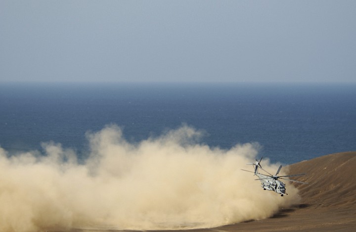 Wall of Sand Kicked Up By the United States Marine Corps CH-53 Sea Stallion Helicopter Along the Coast of Gulf of Tadjoura, Republique de Djiboutim (Jumhuriyaa Jibuti) - Republic of Djibouti. Photo Credit: United States Air Force Photo by Staff Sgt. Stacy L. Pearsall, Navy NewsStand - Eye on the Fleet Photo Gallery (http://www.news.navy.mil/view_photos.asp, 050927-F-7234P-111), United States Navy (USN, http://www.navy.mil); United States Department of Defense (DoD, http://www.DefenseLink.mil or http://www.dod.gov), Government of the United States of America (USA).