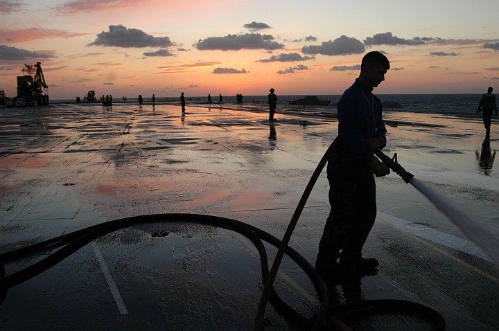 Washing Excess Soap and Foam From the Flight Deck of the USS Kitty Hawk (CV 63), October 24, 2005, Pacific Ocean. Photo Credit: Photographer's Mate Airman Benjamin Dennis, Navy NewsStand - Eye on the Fleet Photo Gallery (http://www.news.navy.mil/view_photos.asp, 051024-N-9389D-084), United States Navy (USN, http://www.navy.mil); United States Department of Defense (DoD, http://www.DefenseLink.mil or http://www.dod.gov), Government of the United States of America (USA).