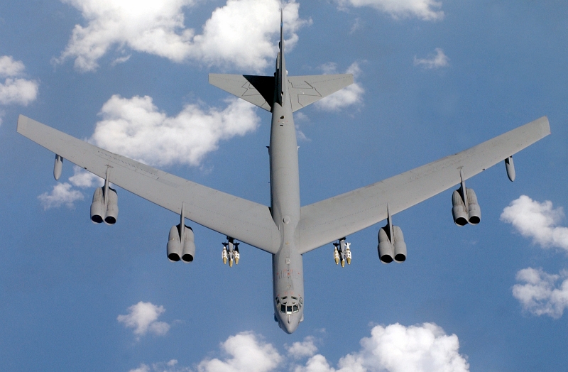 13. Top-Down, Aerial View of a U.S. Air Force (USAF) B-52 Stratofortress, Assigned to the 40th Expeditionary Bomb Squadron (EBS), Loaded With Joint Direct Attack Munitions (JDAM) During Operation Iraqi Freedom, April 15, 2003. Photo Credit: Tech. Sgt. (TSgt.) Richard Freeland, United States Air Force; Defense Visual Information (DVI, http://www.DefenseImagery.mil, 030415-F-7194F-015 and DF-SD-05-05787) and United States Air Force (USAF, http://www.af.mil), United States Department of Defense (DoD, http://www.DefenseLink.mil or http://www.dod.gov), Government of the United States of America (USA).