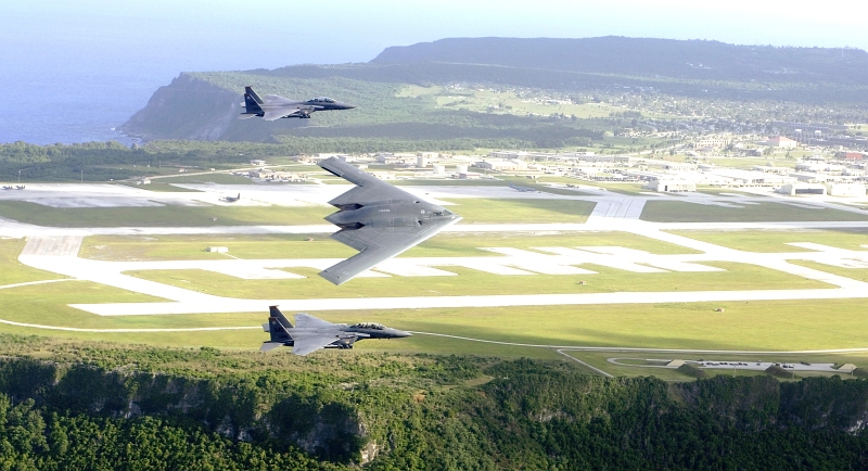 1. Natural Beauty, U.S. National Defense Power and Strength: A Commanding Aerial View of the Ocean and Cliffs, Andersen Air Force Base, and the B-2 Spirit Stealth Bomber and Two F-15E Strike Eagle Fighter Jets Flying in Formation Over Andersen Air Force Base, July 2005. Territory of Guam, USA. Photo Credit: Tech. Sgt. Cecilio M. Ricardo, Air Force Link - Photos (http://www.af.mil/photos, 060707-F-3961R-001, "Joining forces"), United States Air Force (USAF, http://www.af.mil), United States Department of Defense (DoD, http://www.DefenseLink.mil or http://www.dod.gov), Government of the United States of America (USA). See also ChamorroBible.org: Manguaguan na Palabran Si Yuus, Tenjos (Agosto) 22, 2005 <http://ChamorroBible.org/gpw/gpw-20050822.htm>.