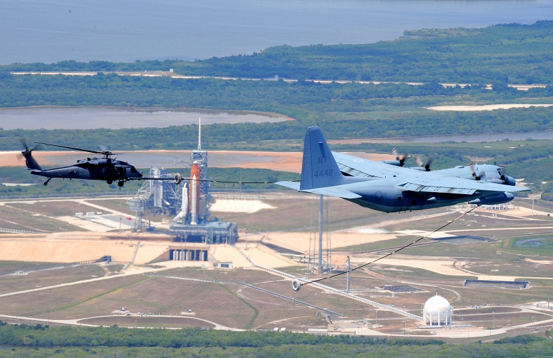 20. As Space Shuttle Atlantis (STS-125) Sits On Launch Pad 39A, a U.S. Marine Corps C-130 Hercules Refuels a U.S. Air Force 920th Rescue Wing (RQW) HH-60G Pave Hawk Helicopter, May 11, 2009 Photo Credit: Tech. Sgt. Gillian M. Albro, 920th Rescue Wing, Air Force Reserve Command; Air Force Link - Photos (http://www.af.mil/photos, 090511-F-0403A-001, "Astronaut Rescuers Refuel"), United States Air Force (USAF, http://www.af.mil), United States Department of Defense (DoD, http://www.DefenseLink.mil or http://www.dod.gov), Government of the United States of America (USA).