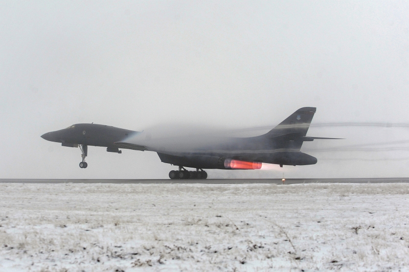 25. A U.S. Air Force B-1B Lancer Long-Range, Supersonic, Heavy Bomber Takes Off In Support of Operation Odyssey Dawn, March 27, 2011, Ellsworth Air Force Base, State of South Dakota, USA. Photo Credit: Staff Sgt. Marc I. Lane, United States Air Force; Defense Visual Information (DVI, http://www.DefenseImagery.mil, 110327-F-VK137-803) and United States Air Force (USAF, http://www.af.mil), United States Department of Defense (DoD, http://www.DefenseLink.mil or http://www.dod.gov), Government of the United States of America (USA).