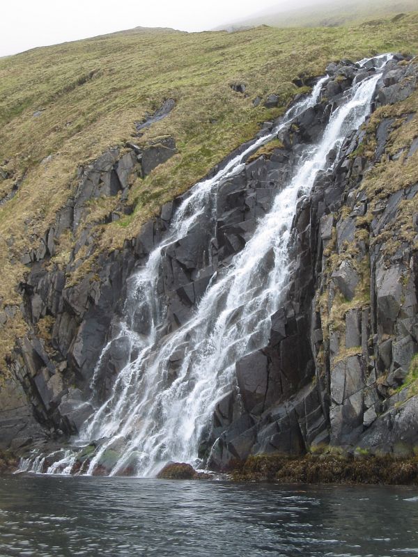 Bay of Waterfalls, June 2002, Alaska Maritime National Wildlife Refuge (AMNWR), Adak, Aleutian Islands, State of Alaska, USA. Photo Credit: Todd Logan, Alaska Image Library, United States Fish and Wildlife Service Digital Library System (http://images.fws.gov, AMNWR/digital/Logan), United States Fish and Wildlife Service (FWS, http://www.fws.gov), United States Department of the Interior (http://www.doi.gov), Government of the United States of America (USA).