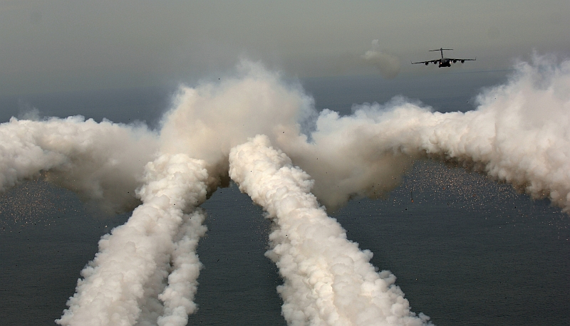 3. A United States Air Force C-17 Globemaster III Military Transport with the 14th Airlift Squadron located at Charleston Air Force Base in South Carolina leaves a smoke trail after firing flares over the Atlantic Ocean during a local exercise. May 16, 2006, Over the Atlantic Ocean Near Charleston, State of South Carolina, USA. Photo Credit: TSgt. Russell E. Cooley IV, United States Air Force (USAF, http://www.af.mil); Defense Visual Information Center (DVIC, http://www.DoDMedia.osd.mil, 060516-F-9712C-446) and United States Air Force (USAF, http://www.af.mil), United States Department of Defense (DoD, http://www.DefenseLink.mil or http://www.dod.gov), Government of the United States of America (USA).. C-17 Globemaster III fact sheets from the United States Air Force <http://www.af.mil/factsheets/factsheet.asp?fsID=86> and The Boeing Company <http://www.boeing.com/defense-space/military/c17/index.htm>.