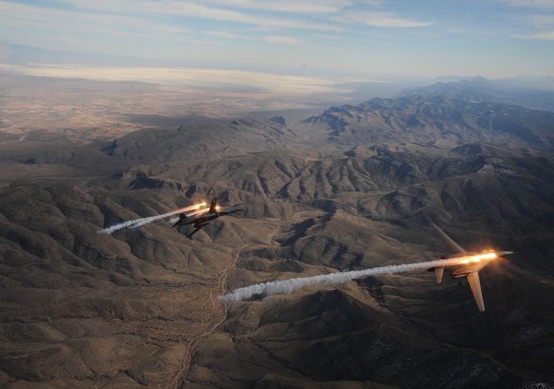 5. Two USAF B-1B Lancer Heavy Bombers -- attached to the 28th Bomb Squadron, Dyess Air Force Base, Texas -- Release Chaff and Flares During A Training Mission, February 24, 2010, State of New Mexico, USA. Photo Credit: Master Sgt. Kevin J. Gruenwald, United States Air Force; Defense Visual Information (DVI, http://www.DefenseImagery.mil, 100224-F-6911G-003) and United States Air Force (USAF, http://www.af.mil), United States Department of Defense (DoD, http://www.DefenseLink.mil or http://www.dod.gov), Government of the United States of America (USA).