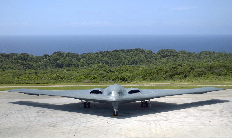 23. Backdropped By the Pacific Ocean, A U.S. Air Force B-2 Spirit Stealth Bomber Sits On the Ramp at Andersen Air Force Base, March 24, 2005. Photo Credit: Staff Sgt. Bennie J. Davis III, United States Air Force; Defense Visual Information (DVI, http://www.DefenseImagery.mil, DF-SD-08-16977, 050324-F-5040D-013, and 050324-F-VY627-013) and United States Air Force (USAF, http://www.af.mil), United States Department of Defense (DoD, http://www.DefenseLink.mil or http://www.dod.gov), Government of the United States of America (USA).