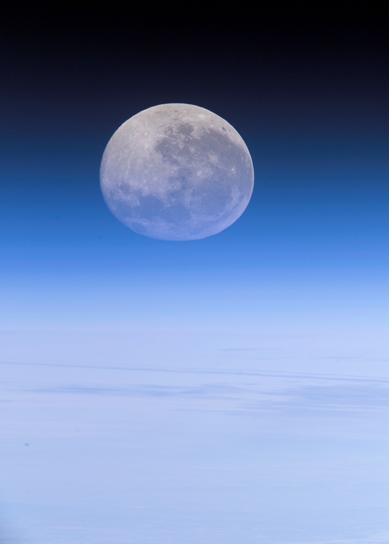 19. Over the Pacific Ocean, Earth's Moon Viewed Through and Above Earth's Blue Atmospheric Limb, July 30, 2007 at 21:37:34.746 GMT As Seen From the International Space Station (Expedition 15); Latitude (LAT): -23.9, Longitude (LON): 165.9, Altitude (ALT): 183 Nautical Miles, Sun Azimuth (AZI): 55 degrees, Sun Elevation Angle (ELEV): 25 degrees. Photo Credit: NASA; ISS015-E-20487, Moon (Luna), Earth's Blue Atmospheric Limb, Clouds, Pacific Ocean, International Space Station (Expedition Fifteen); Image Science and Analysis Laboratory, NASA-Johnson Space Center. 'Astronaut Photography of Earth - Display Record.' <http://eol.jsc.nasa.gov/scripts/sseop/photo.pl?mission=ISS015&roll=E&frame=20487>; National Aeronautics and Space Administration (NASA, http://www.nasa.gov), Government of the United States of America (USA).