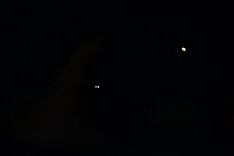 46. The International Space Station and Earth's Moon Surrounded By the Blackness of Space, July 10, 2011, As Seen From Space Shuttle Atlantis (STS-135). Photo Credit: NASA; STS-135 Shuttle Mission Imagery (http://spaceflight.nasa.gov/gallery/images/shuttle/sts-135/ndxpage1.html): S135-E-006690 (http://spaceflight.nasa.gov/gallery/images/shuttle/sts-135/html/s135e006690.html), NASA Human Space Flight (http://spaceflight.nasa.gov), National Aeronautics and Space Administration (NASA, http://www.nasa.gov), Government of the United States of America.